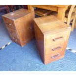 A pair of Art Deco period three-drawer walnut bedside-style cabinets on plinth bases (36cm wide x