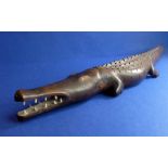 A good early 20th century carved African hardwood crocodile; the open mouth showing an arrangement