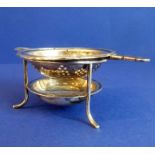 An early 20th century hallmarked silver strainer and stand; assayed Sheffield (total weight 86g)