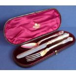 A cased silver knife, fork and spoon set; the knife blade assayed Sheffield 1862