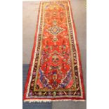 A hand-knotted Persian Hamadan runner (310cm x 104cm)