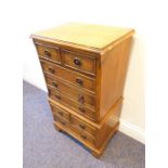 A yew wood chest of small proportions; in the design of a chest-on-chest with two half-drawers