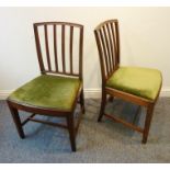 A pair of late 18th century mahogany salon chairs; vertical splat rests, drop-in seats and square