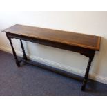An early 20th century console/side table; in oak with a yew-wood cross-banded top, scratch-moulded