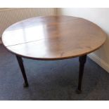 A mid/late 18th century oval drop-leaf mahogany gate-leg dining table raised on turned tapering legs