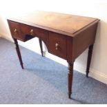 A 19th century mahogany side/writing table; thumbnail-moulded top above three drawers and raised