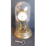 An early 20th century anniversary-style clock;  cream dial with Arabic numerals, under a glass