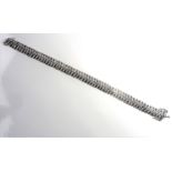 A white-gold (375) multi-diamond bracelet (16.6g) (The cost of UK postage via Royal Mail Special