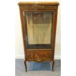 An early 20th century Louis XVI style marble-topped kingwood and gilt-metal-mounted vitrine;