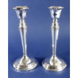 A pair of hallmarked silver candlesticks, Birmingham 1916