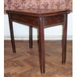 A George III period late 18th century fold-over top mahogany tea table on square, moulded