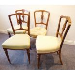 A set of four 19th century walnut salon chairs