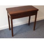 A mid-18th century mahogany fold-over-top card table; the figured top above the two edges opening to