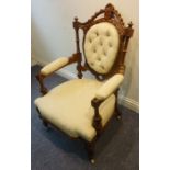 A good and unusual carved walnut and upholstered button-back open armchair from third quarter 19th
