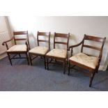 A set of four (2+2) early 19th century Regency period mahogany dining chairs; carved wood tablet-