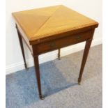 A good Edwardian period mahogany envelope-style card table having cross-banded top with carved