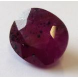 A cushion-cut ruby of approximately 3.30 carats (unmounted) (The cost of UK postage via Royal Mail