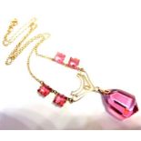 A 9-carat gold necklace set with pink stones (probably pink topaz) (The cost of UK postage via Royal