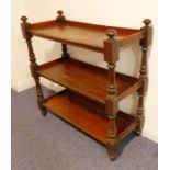 A mid-19th century three-tier mahogany dumb waiter on (loose) castors (102cm wide x 44.5cm deep x