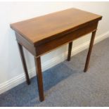 A late 18th century George III period fold-over top mahogany tea table on square chamfered legs (