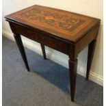 A late 18th/early 19th century Italianate rosewood fold-over top card table; marquetry frieze and