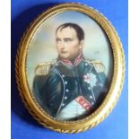 An oval gilt-metal framed and glazed portrait miniature of Napoleon, signed middle right (8.5cm high