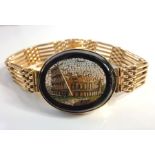 An unusual 9-carat gold bracelet with a micro mosaic panel (The cost of UK postage via Royal Mail