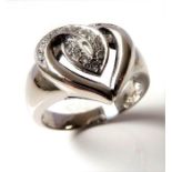 An 18-carat white gold 'heart' ring set with diamonds, ring size N/O (5.6g) (The cost of UK