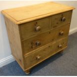 A late 19th century pine chest; overhanging top above two half-width and two full-width drawers