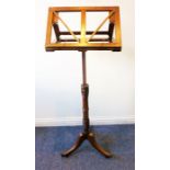 A Regency period extending mahogany music stand; turned annulated stem and raised on tripod base