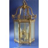 A large and heavy ceiling hanging hexagonal brass and glass-sided lantern (approx. 31.5cm wide x