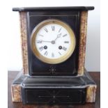 A late 19th century black-slate and marble eight-day mantel clock; white-enamel dial with Roman