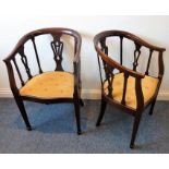 A pair of early 20th century mahogany bergere style tub chairs; pierced splats, overstuffed