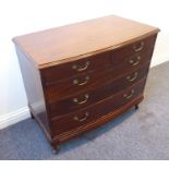 An early 20th century reproduction bow-fronted mahogany chest; two half-width over three full-
