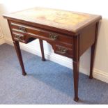 An early 20th century Edwardian walnut writing table having an unusual fold-over top with interior