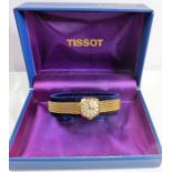 A boxed 'Tissot' 9-carat gold watch and bracelet in working order (19.64g) (The cost of UK postage