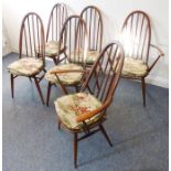 A set of six (4+2) Ercol comb-back dining chairs having shaped elm seats  Condition Report: The