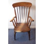 A late 19th century lathe-back chair having shaped elm feet