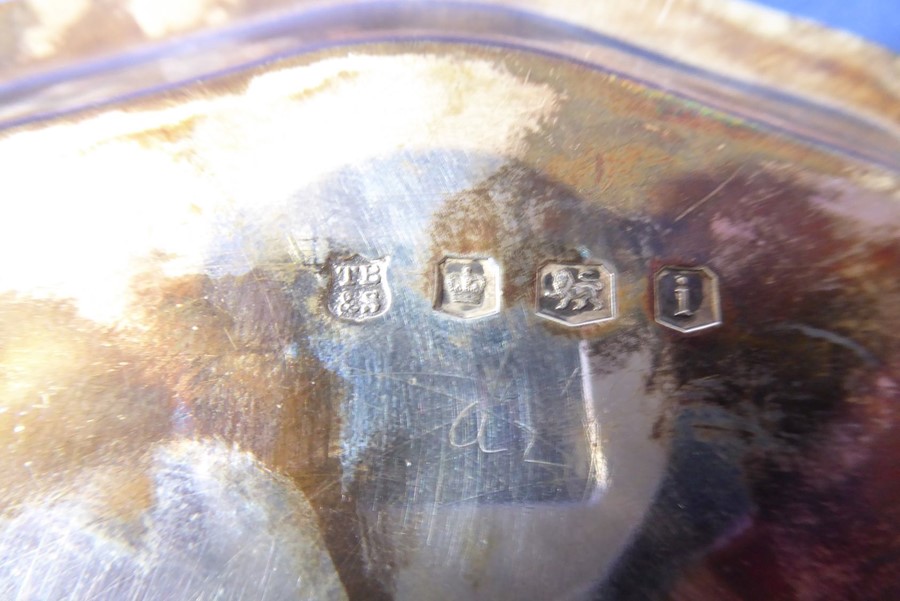 A small hallmarked silver salver with pie-crust edge and raised on three cast feet; Sheffield - Image 2 of 2