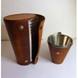 Two tan-leather cased sets of concentric hunting cups (The cost of UK postage via Royal Mail Special