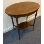 An oval Edwardian mahogany and satinwood-crossbanded occasional table on four square tapering
