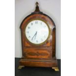 A late 19th century mahogany-cased mantel clock; circular white dial with Arabic numerals, the domed