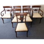 A good set of seven (5+2) Regency-period mahogany dining chairs; the two carvers with concave,