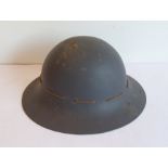 A 1941 air warden's helmet by C.C. & S. Ltd; size 6 ¾, the leather liner damaged