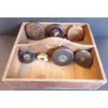 A late 19th / early 20th century two-division pine box and seven tape measures (16.5” long, 15.25”