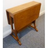 An early 20th century oak Sutherland table with two drop leaves