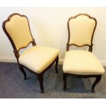 A pair of Louis XV 18th century French walnut upholstered salon chairs; cabriole front legs