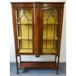 A good Edwardian mahogany, boxwood-strung and marquetry display cabinet: the two doors with astragal