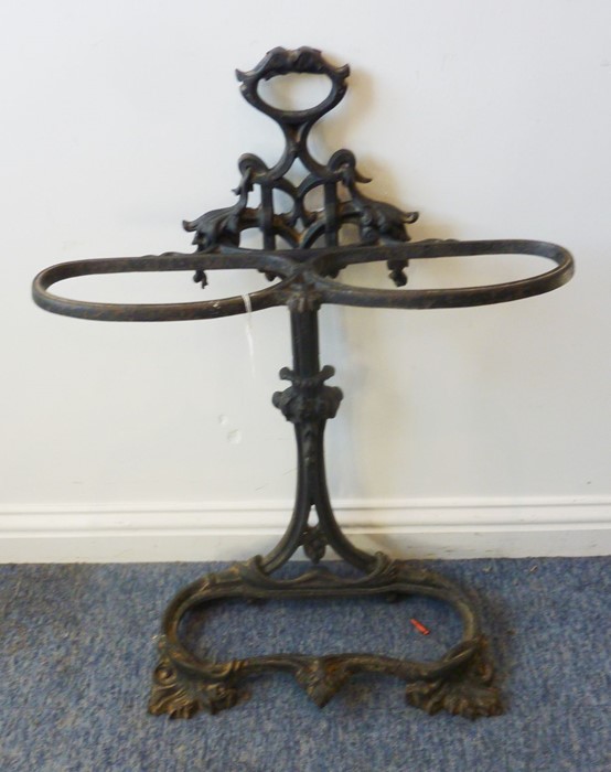 A black-painted cast-iron double umbrella/stick stand