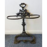 A black-painted cast-iron double umbrella/stick stand